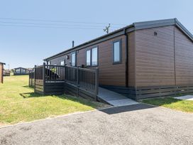An outdoor view of a lodge with ramps at Atlantic Breeze Luxury Lodge sleep 6 Mullacott near Ilfracombe