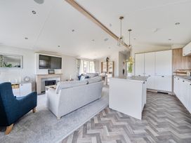 A living room with a television and sofa at Atlantic Breeze Luxury Lodge sleep 6 Mullacott near Ilfracombe
