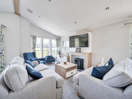 A living room with a sofa and armchairs at Atlantic Breeze Luxury Lodge sleep 6 Mullacott near Ilfracombe