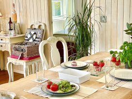 A dining room with a table set for a meal at Stunning Sleeps 6 Luxury Lodge Pets Mercia Marina near Willington, Derbyshire