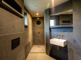 A bathroom with a shower and sink at the property