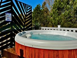 A hot tub on a deck surrounded by a fence at Meadows 33 Hot tub Southview Holiday Park Skegness