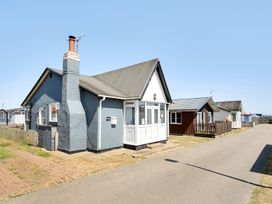 A house with a chimney and mailbox at Seahorse Chalet Sleeps 6 Pets Log Burner Beach in Bridlington