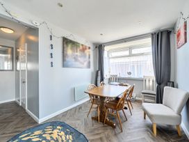 A dining room with a table and chairs at Seahorse Chalet Sleeps 6 Pets Log Burner Beach in Bridlington