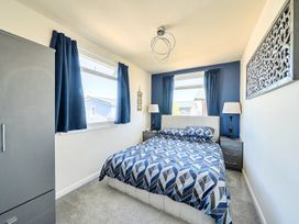 A bedroom with a bed and lamps at Seahorse Chalet Sleeps 6 Pets Log Burner Beach in Bridlington