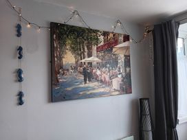A living room with a painting on the wall at Seahorse Chalet Sleeps 6 Pets Log Burner Beach in Bridlington