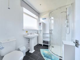 A bathroom with a shower, sink, and toilet at Seahorse Chalet Sleeps 6 Pets Log Burner Beach in Bridlington
