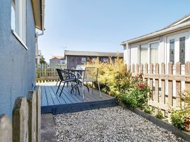 An outdoor area with a table and chairs at Seahorse Chalet Sleeps 6 Pets Log Burner Beach Bridlington