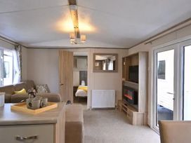 A living room with a sofa and coffee table at the property in location