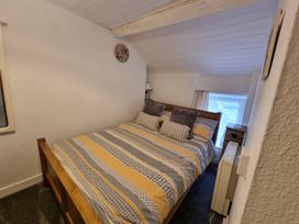 A bedroom with a bed and window at the property in location