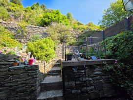A garden with stone walls and steps at a property