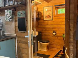 A bathroom with a sink and toilet at The Crystal Lounge in an unknown location