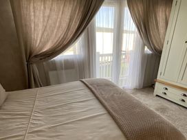 A bedroom with a bed and a wardrobe at the property