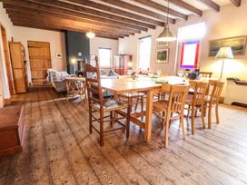 A dining room with a table and chairs at Llys Gwaun in Fishguard