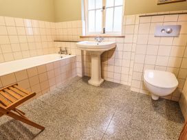 A bathroom with a bathtub, sink, and toilet at Llys Gwaun in Fishguard