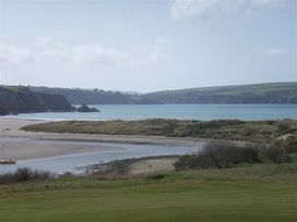 A beach and water view at Llys Gwaun in Fishguard