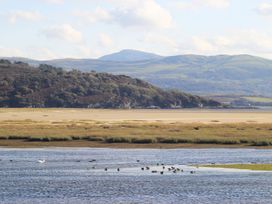 A view of water with ducks and mountains at Aldena South Snowdon Wharf in Porthmadog