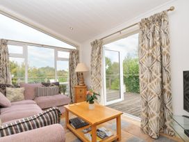A living room with a sofa and coffee table at 5 Tree Tops in Dobwalls