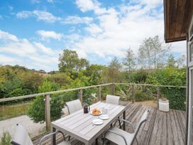 An outdoor area with a table and chairs at 5 Tree Tops Dobwalls