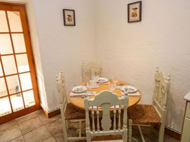 A dining room with a table and chairs at The Stable in Haverfordwest