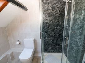 A bathroom with a shower and toilet at The Stable in Haverfordwest