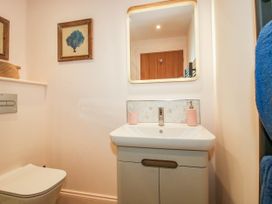 A bathroom with a sink and toilet at Little Red Barn in Wallop near Westbury