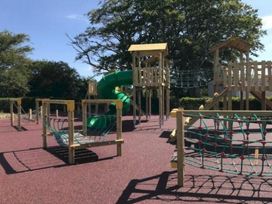 A playground with a slide and climbing frame at Glendale holiday park in Wigton