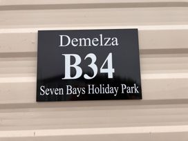 A sign indicating Demelza B34 at Seven Bays Holiday Park