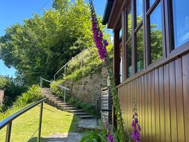 An outdoor area with stairs leading to a pathway at The Old Forge in Hallsands