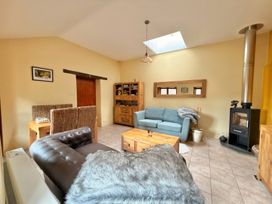 A living room with a sofa and coffee table at The Old Forge in Hallsands