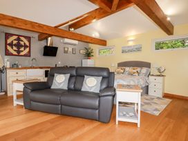 A studio with a sofa and bed at Brambleside Lodge in Truro