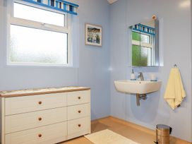 A bathroom with a sink and drawer unit at Brambleside Lodge in Truro
