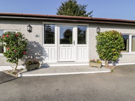 An entrance with a white door and planters at Lower Brambleside in Truro