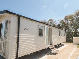 A mobile home with steps and entrance at 14 Pines in Cayton Bay