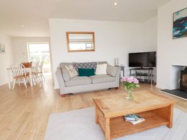 A living room with a sofa and coffee table at Cloudbreak in Wadebridge