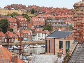 A view of houses and boats in Whitby Harbor at 14 Brunswick Street Whitby
