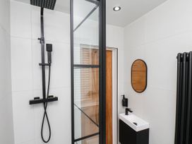 A bathroom with a shower and sink at 14 Brunswick Street Whitby