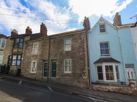 A street view of residential buildings at 57 High Street in Portland