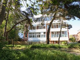 A building with windows and trees in front at The Pines Bournemouth