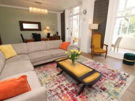 A living room with a sofa and coffee table at The Pines in Bournemouth