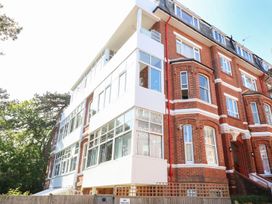 A building with multiple windows and brick facade at The Pines in Bournemouth