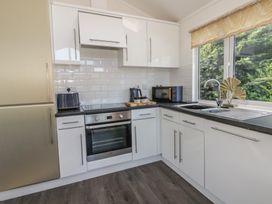 A kitchen with appliances and a countertop at 73 Cildraeth in New Quay