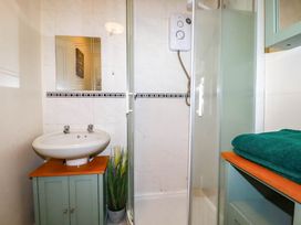 A bathroom featuring a sink and shower at Seaside Retreat in Newquay