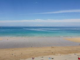 A beach with people enjoying at Seaside Retreat in Newquay