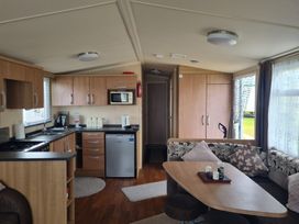 A kitchen and living area in Stoup cross caravan park Whitby