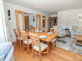 A dining room with a table and chairs at 33 Dart Marina Dartmouth