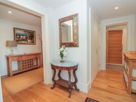 An entrance hall with a console table and mirror at 33 Dart Marina Dartmouth