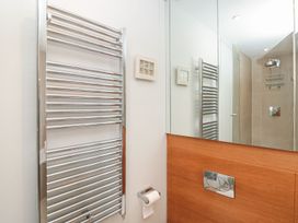 A bathroom with a towel rail and shower at 33 Dart Marina in Dartmouth