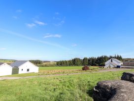 A view of houses and trees in a field at Angels Place in Yelverton