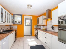 A kitchen with appliances and cabinetry at Angels Place in Yelverton